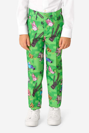 Green pants with Minecraft print worn by a person on a white background