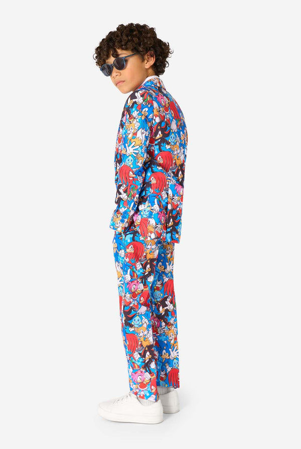 Child wearing a colorful Sonic-themed onesie on a white background