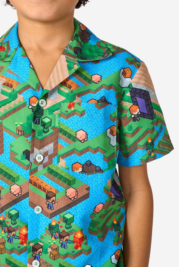 Person wearing a colorful Minecraft shirt with a pixelated game design