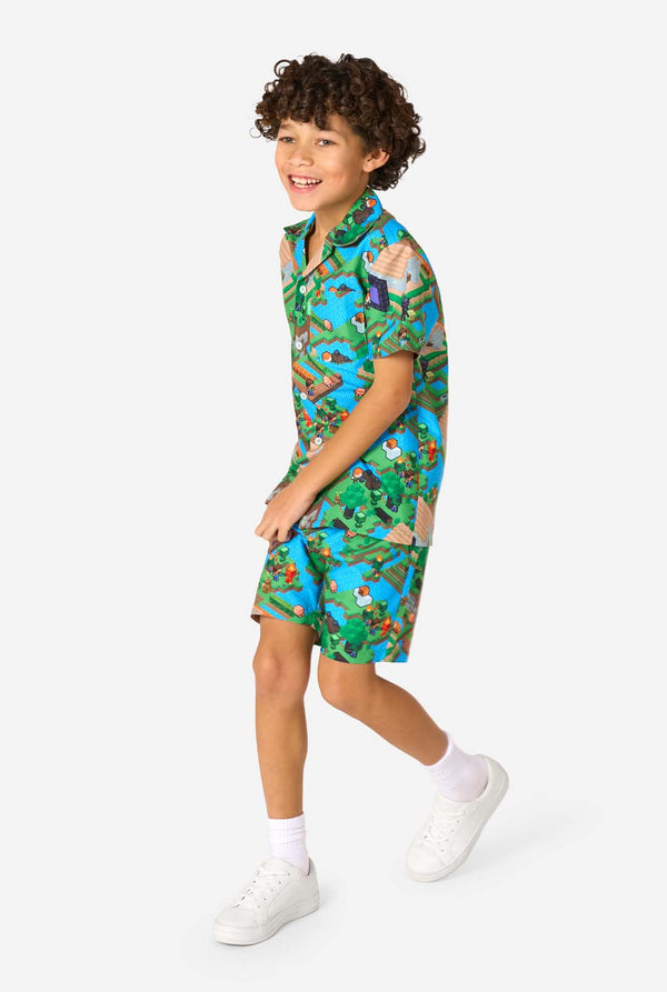 Child wearing a colorful Minecraft-themed summer set on a white background