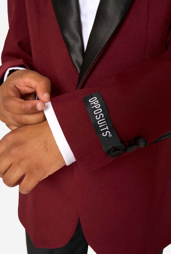 Maroon suit jacket with black lapels and Opposuits label on a white background