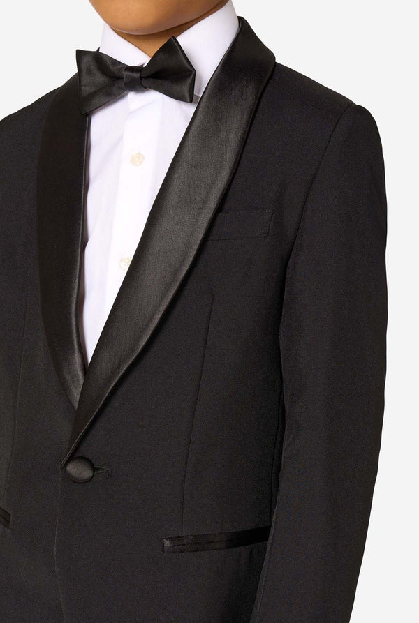 Black tuxedo with a bow tie on a white background. Chest close up.
