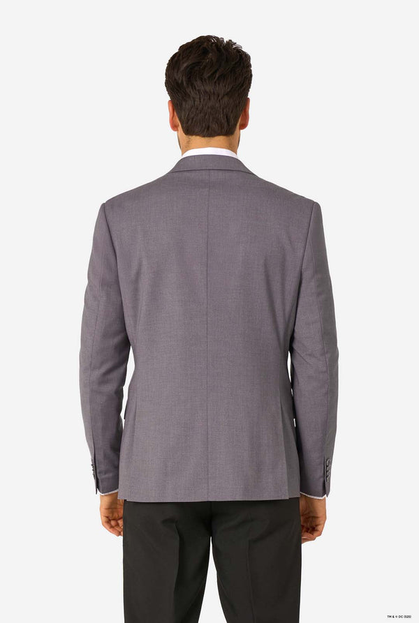 Gray suit jacket worn by a person on a white background. View from the back