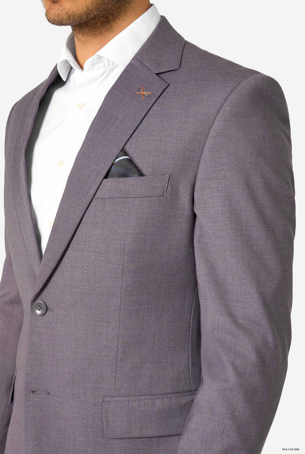 Gray suit jacket with a white shirt underneath on a plain background