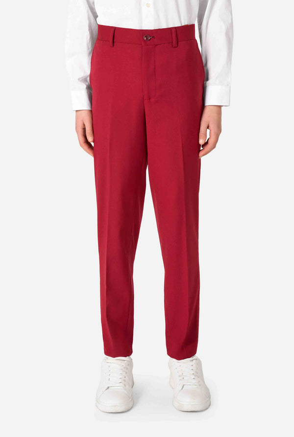 Teen boy wearing a stylish burgundy red suit with a white dress shirt, looking confidently. Perfect formal outfit for boys' special occasions, weddings, and parties. Close up pants.