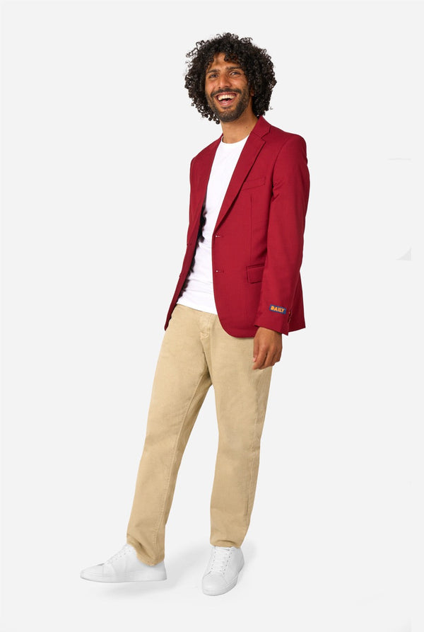 Man wearing a red blazer, white shirt, beige pants, and white shoes on a white background. Full body image