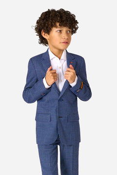 Child wearing a blue checkered suit with a white shirt on a white background