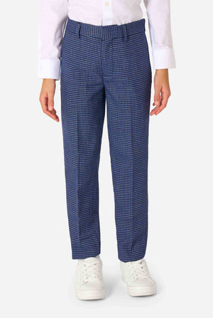 Person wearing blue checkered pants and white sneakers on a white background