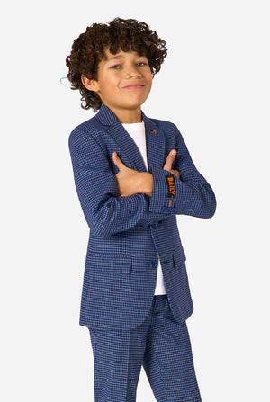 Child wearing a blue checkered suit on a white background