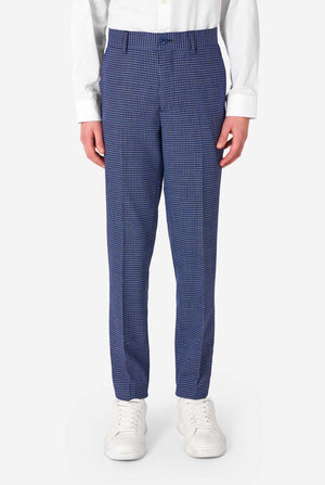 Person wearing blue checkered pants on a white background