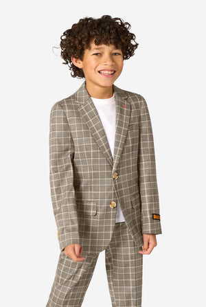 Child wearing a checkered suit with a plain background
