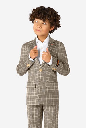 Child wearing a checkered suit with a white shirt on a white background