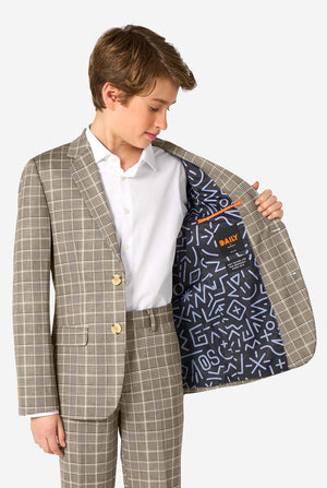 Child wearing a tan checkered suit with a patterned lining, holding the jacket open.