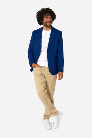 Man wearing a blue blazer, white shirt, beige pants, and white sneakers on a white background. Full body image