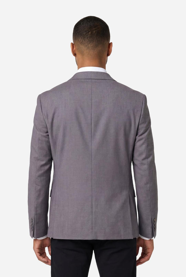 Man wearing a gray suit jacket on a white background. View from the back
