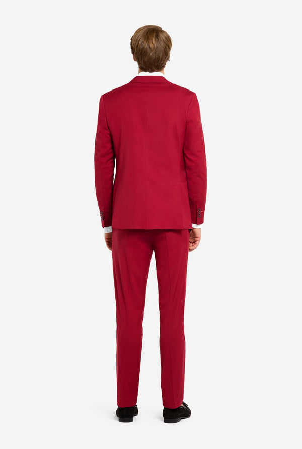 Person wearing a red suit on a white background. View from the back