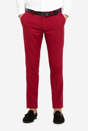 Red pants worn with a white shirt on a white background