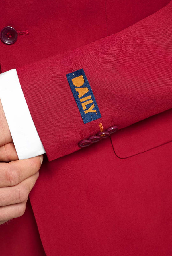 Red garment with a 'DAILY' label on a plain background