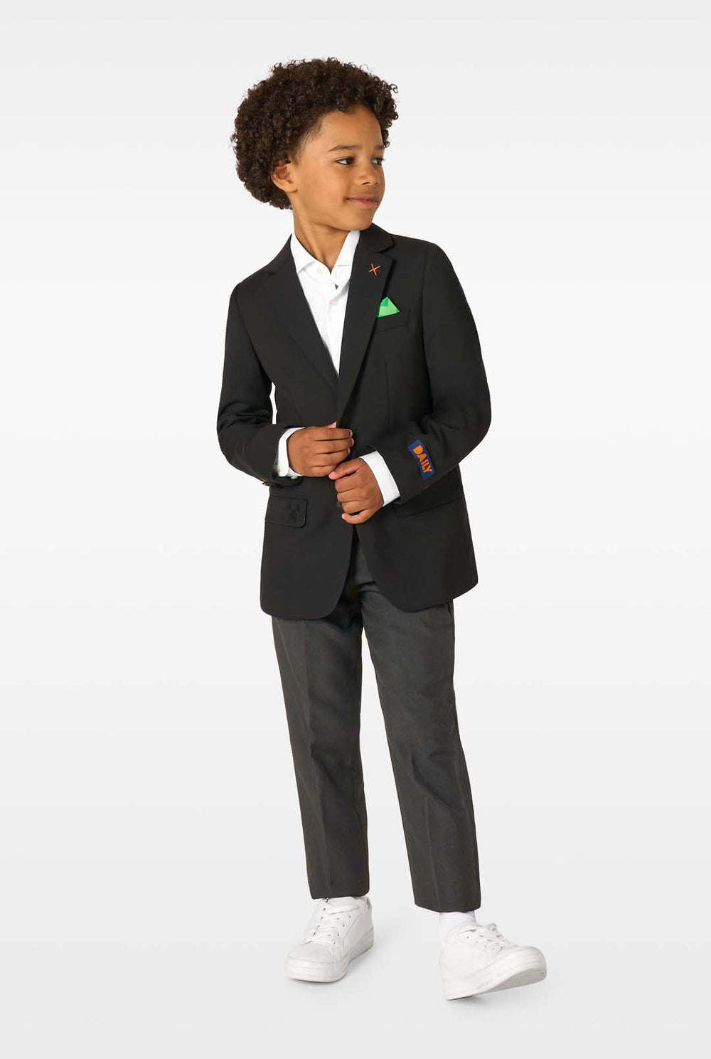 Child wearing a black blazer with colorful accents on a white background