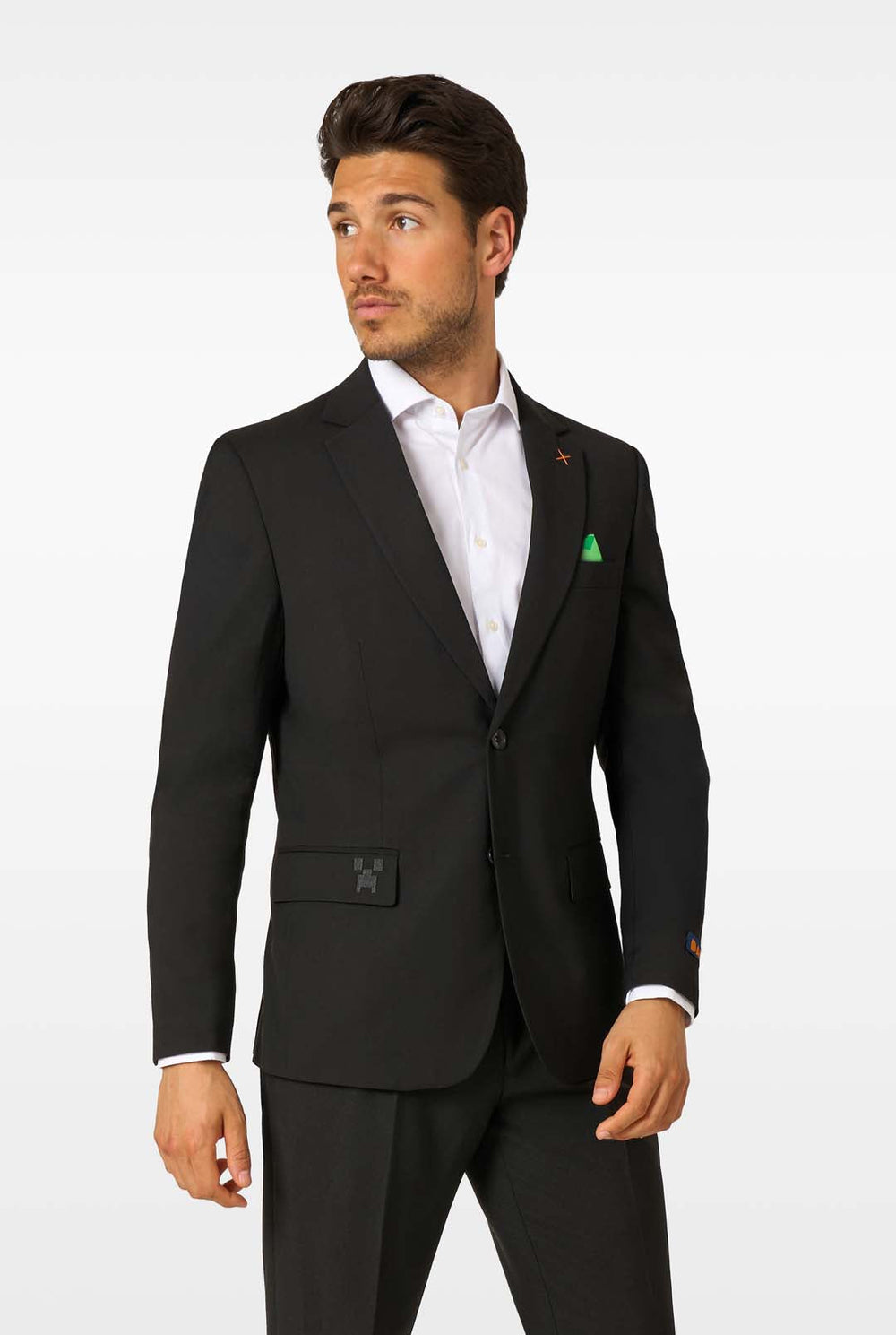 Man wearing a black suit with a white shirt on a white background