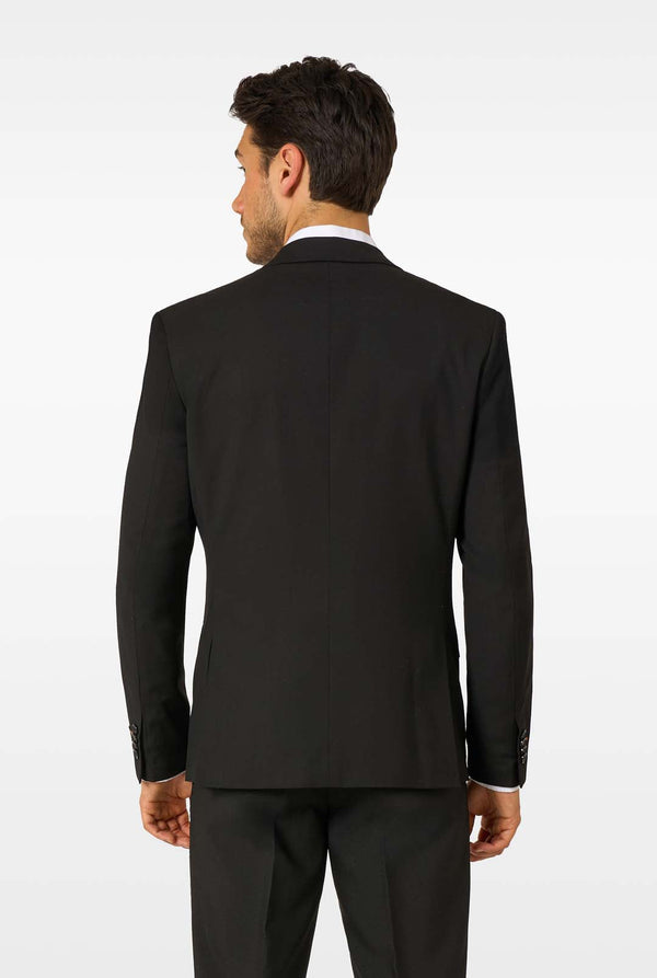Man wearing a black suit jacket on a white background
