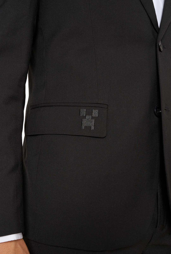 Black suit jacket with a brand logo on the chest pocket against a white background