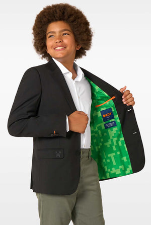 Child wearing a black blazer with a green Minecraft design jacket inside, on a white background