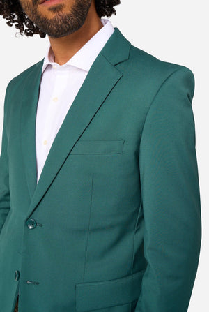 Posy green suit jacket worn by a person on a white background. Close up of the chest