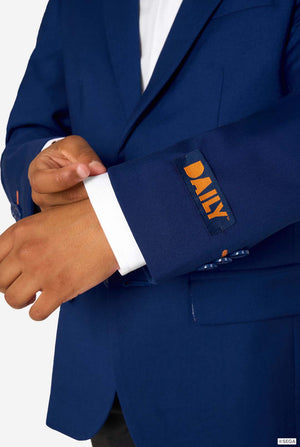 Kid wearing a blue Sonic-themed blazer with a white shirt and dark pants on a light gray background. Close up of the sleeve.