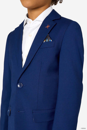 Kid wearing a blue Sonic-themed blazer with a white shirt and dark pants on a light gray background. Close up of the chest.