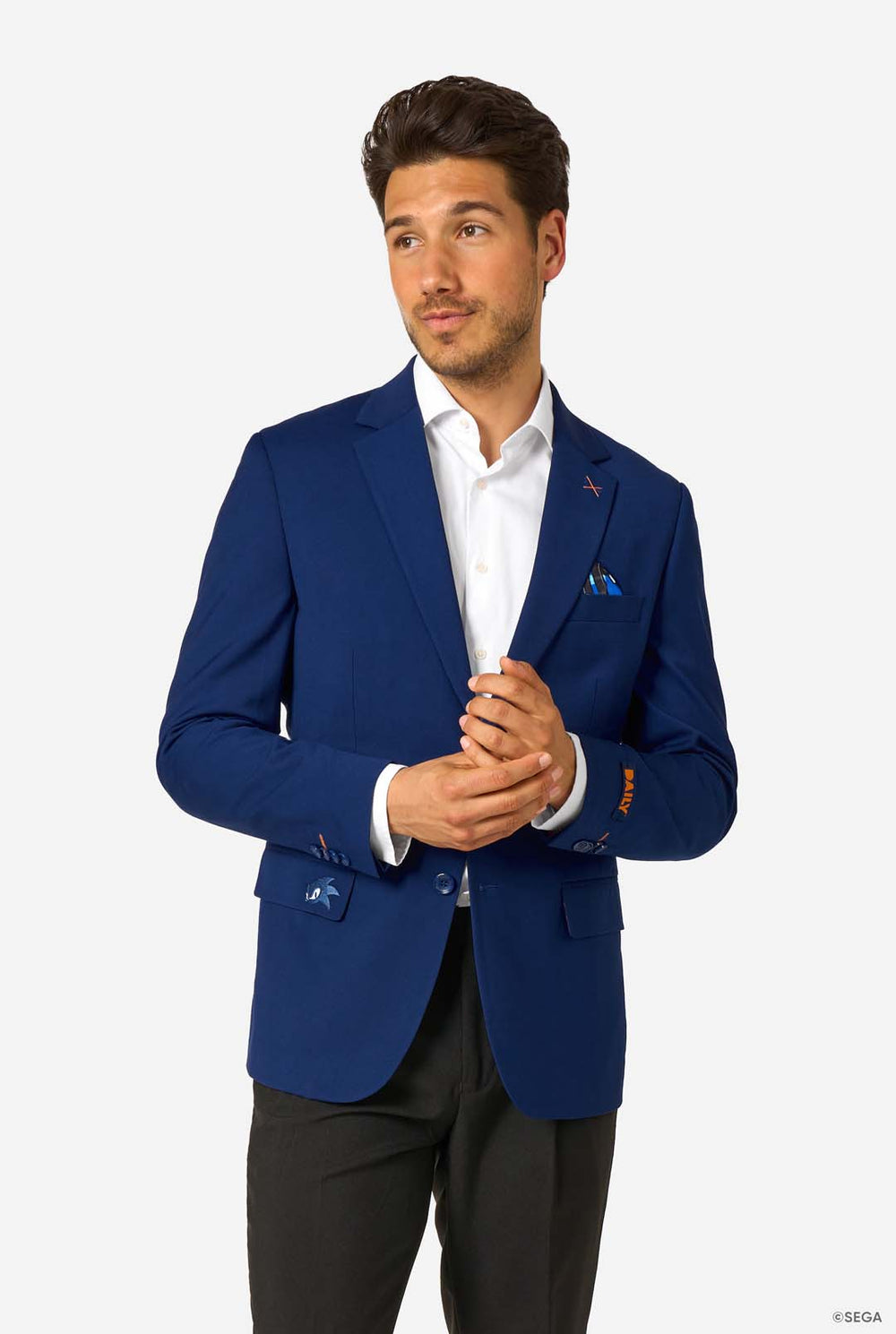 Man wearing a blue blazer with a white shirt and black pants on a white background