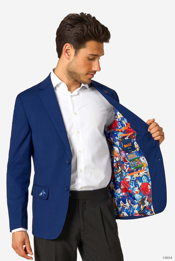 Man wearing a blue blazer with a colorful Sonic interior, standing against a white background