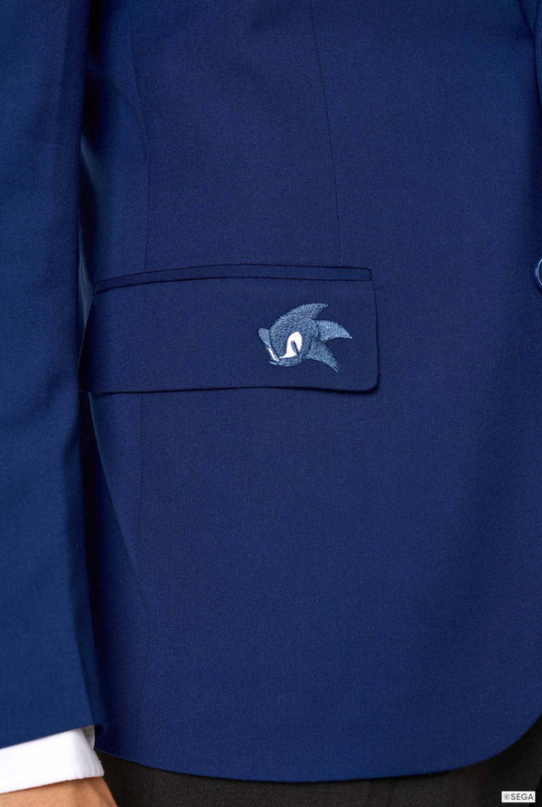 Close-up of a blue jacket with an embroidered Sonic logo on the chest pocket.