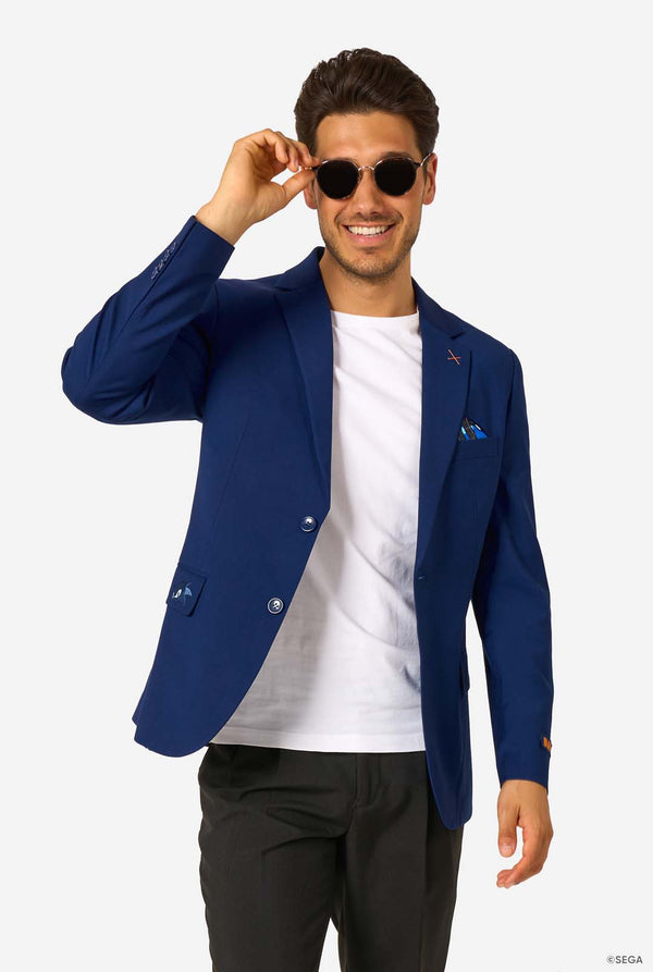Man wearing a blue blazer, white shirt, and black pants on a white background