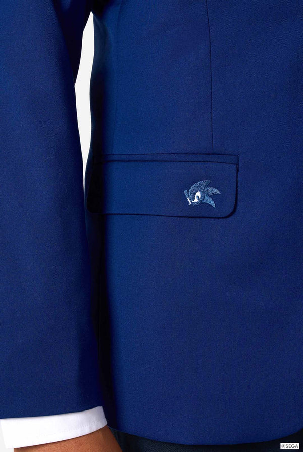 Close-up of a blue jacket with a Sonic logo on the chest pocket against a white background