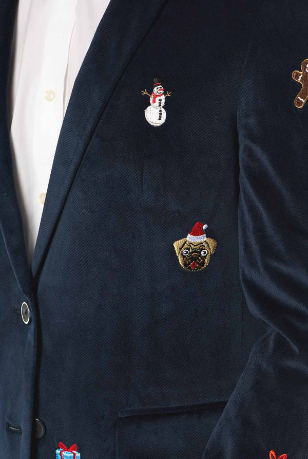 Man wearing navy blue Christmas blazer with Christmas embroidery, close up