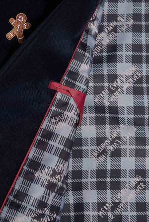 Man wearing navy blue Christmas blazer with Christmas embroidery, close up inside