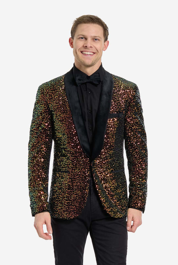 Man wearing a sequin tuxedo jacket on a white background