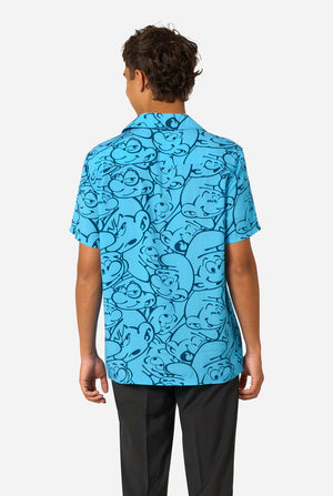 Person wearing a blue Smurfs patterned shirt with black pants on a white background. View from the back