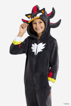 Child wearing a black Shadow onesie on a white background