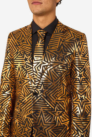 Man wearing a gold and black star-patterned suit jacket on a white background