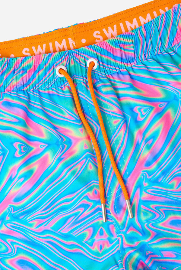 Colorful swim shorts with a Holoperfect pattern and orange drawstrings on a white background.