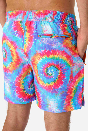 Multicolored tie-dye shorts with a brand logo on a plain background