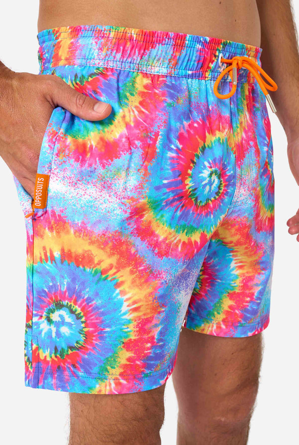 Tie-dye swim shorts with a colorful pattern on a white background