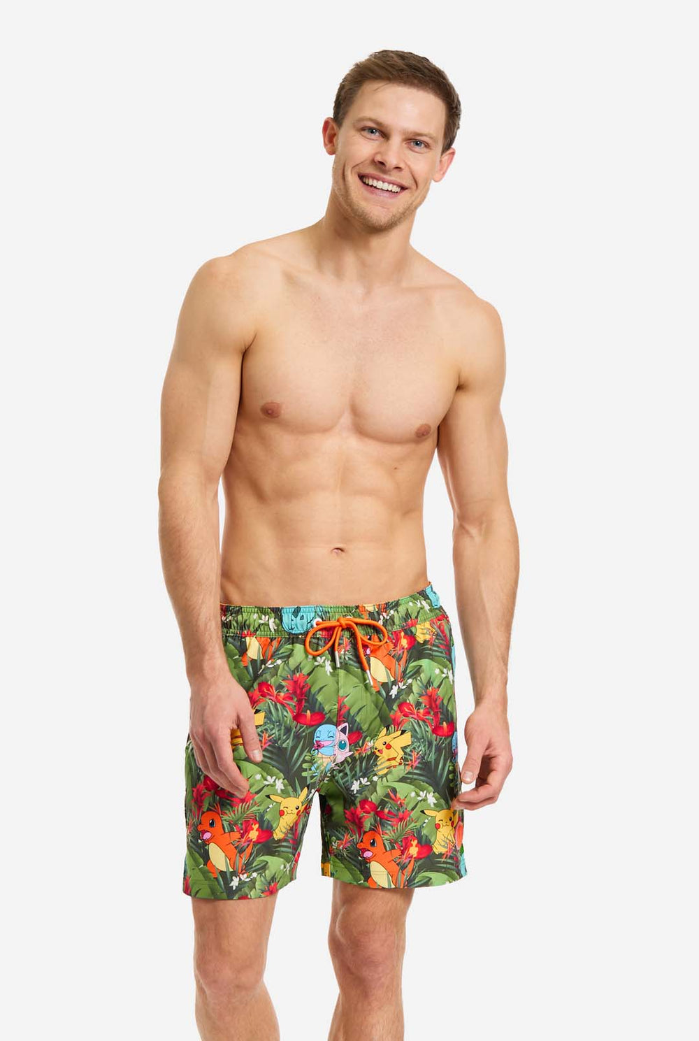 Man wearing swim trunks with Pokemon forest print, close up