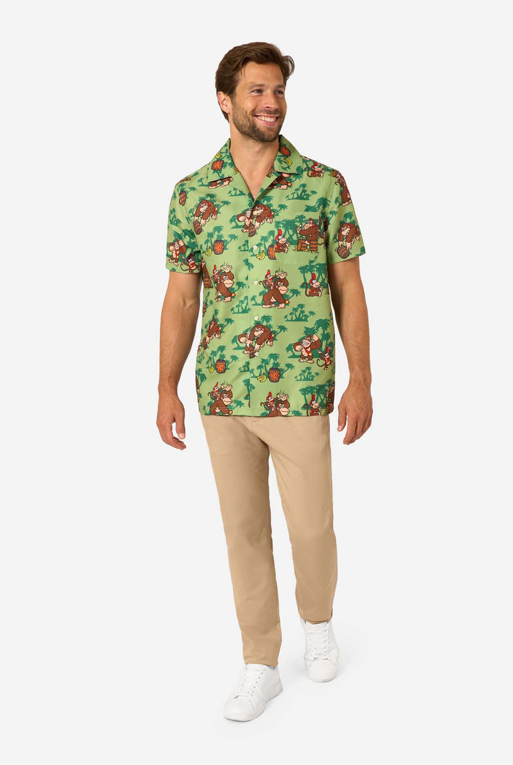 Man wearing a green Hawaiian shirt with Donkey Kong character print on a white background