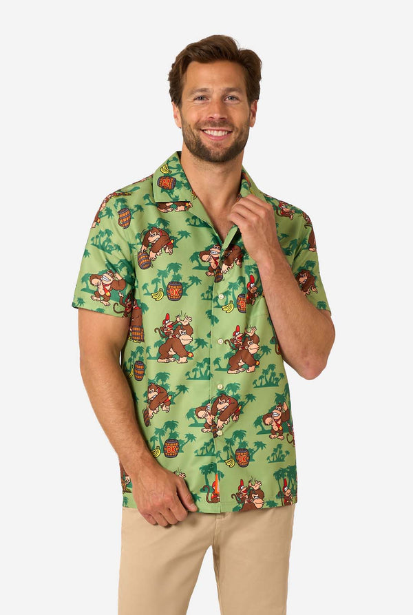 Man wearing a green Donkey Kong patterned shirt against a white background