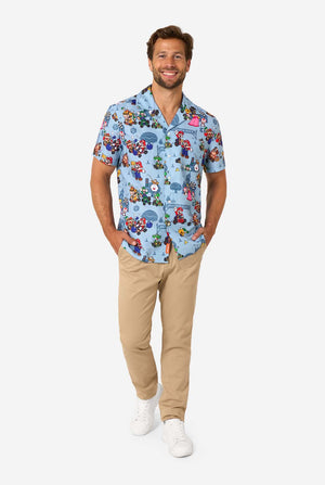 Man wearing a colorful Mario-themed shirt on a white background