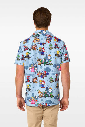 Person wearing a colorful shirt with Mario character pattern on a white background