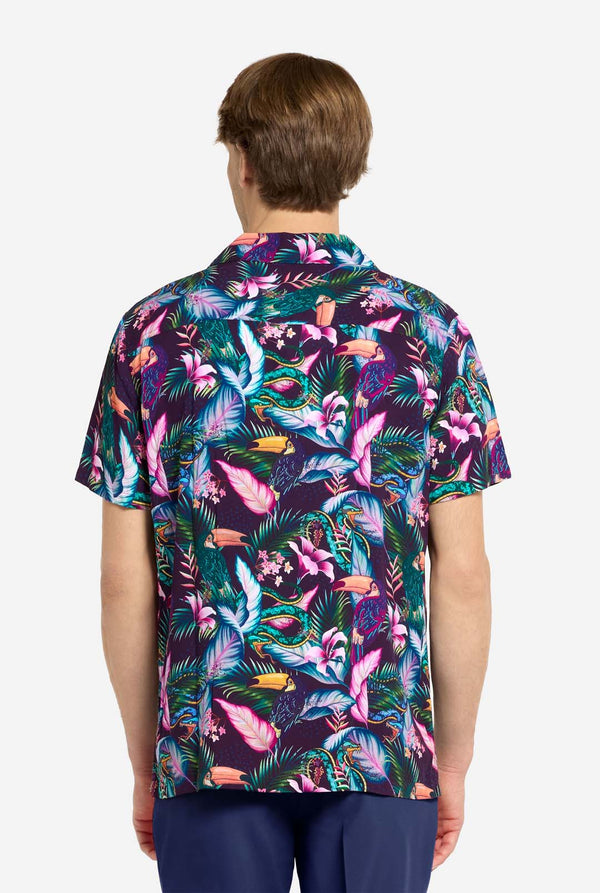 Person wearing a colorful tropical patterned shirt on a white background. View from the back